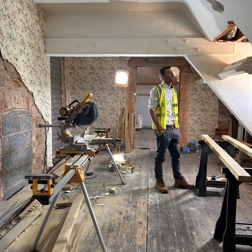 ALS employee inspecting project works in progress